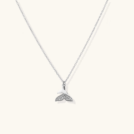 Delicate 14K gold-plated whale tail pendant necklace with sparkling crystal details on fine chain against white background.