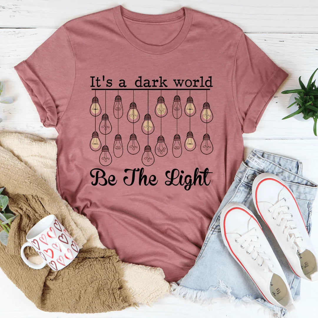 It's A Dark World Be The Light Tee