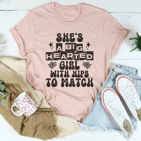 She's a big hearted girl with hips to match Tee